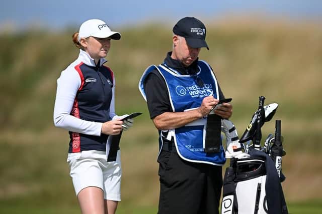 Louise Duncan sizes up her second shot on the tenth hole with caddie Dean Robertson in the first round of the Freed Group Women's Scottish Open presented by Trust Golf at Dundonald Links. Picture: Octavio Passos/Getty Images.