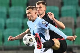 Slovenia's midfielder Josip Ilicic (L) fights for the ball with and Croatia's defender Borna Barisic during the FIFA World Cup Qatar 2022 Group H qualification football match between Slovenia and Croatia at The Stozice Stadium in Ljubljana, Slovenia. (Photo by JOE KLAMAR/AFP via Getty Images)