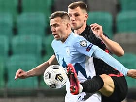 Slovenia's midfielder Josip Ilicic (L) fights for the ball with and Croatia's defender Borna Barisic during the FIFA World Cup Qatar 2022 Group H qualification football match between Slovenia and Croatia at The Stozice Stadium in Ljubljana, Slovenia. (Photo by JOE KLAMAR/AFP via Getty Images)