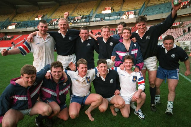 Some of the Scotland team celebrate the famous 23-21 away win over France in 1995. It was the Scots' first ever win at the Parc des Princes and their first win in Paris since 1969.