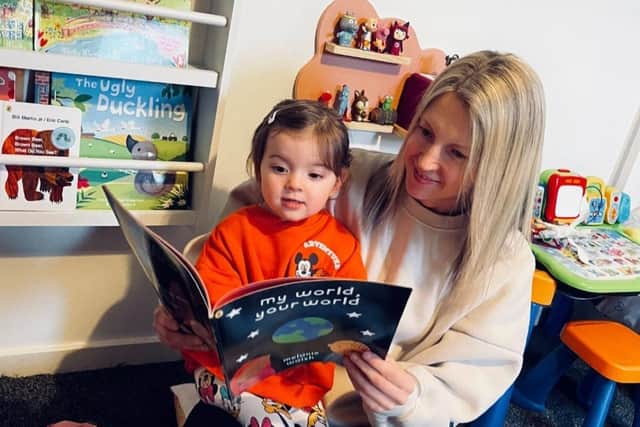 Families have been supported by our partnership with Dolly Parton's Imagination Library - two-year-old Callie and her mother Leigh Stewart