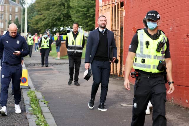 Dundee manager James McPake leads his players down to Tannadice for the first derby of the season in August. This practice of walking to the game could soon be a thing of the past if Dundee leave Dens Park  (Photo by Alan Harvey / SNS Group)