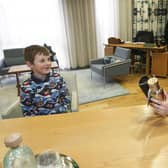 Callum Isted meets Nicola Sturgeon after he spoke to the Scottish Parliament's Public Petitions Committee (Picture: Gordon Terris/Herald and Times/PA Wire)