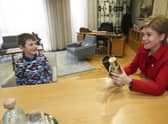 Callum Isted meets Nicola Sturgeon after he spoke to the Scottish Parliament's Public Petitions Committee (Picture: Gordon Terris/Herald and Times/PA Wire)