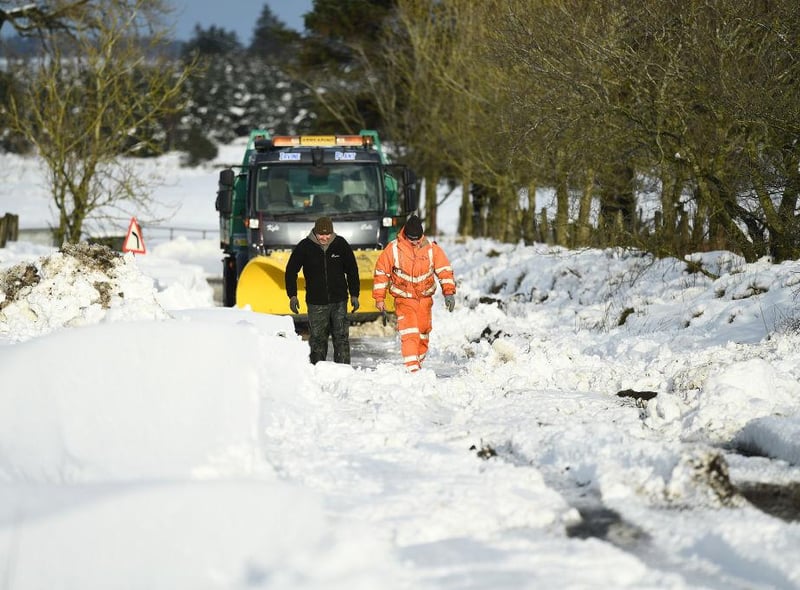 A snow plough can be seen stuck in a snow drift after attempting to clear the snow in Lamancha, Scotland.