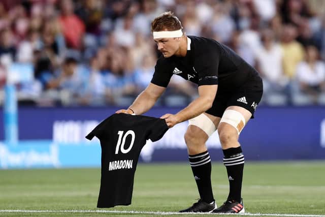 New Zealand captain Sam Cane lays down a No 10 jersey in memory of Diego Maradona prior to the 2020 Tri-Nations match against Argentina. Picture: Brendon Thorne/Getty Images