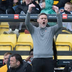 Motherwell Manager Graham Alexander celebrates after the draw against Livingston.