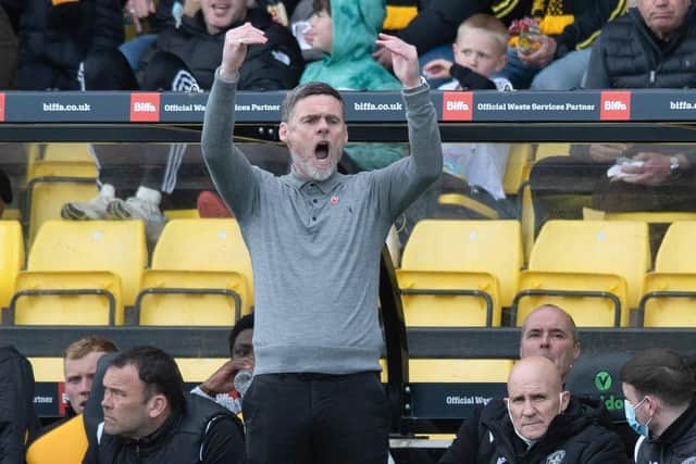 Motherwell Manager Graham Alexander celebrates after the draw against Livingston.