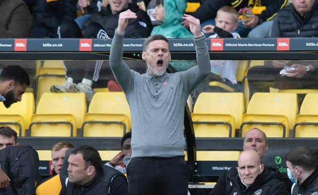 Motherwell Manager Graham Alexander celebrates after the draw against Livingston.