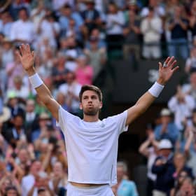 Cameron Norrie breathes hard after the titantic tussle with David Goffin, a victory which takes him into the Wimbledon semi-finals.