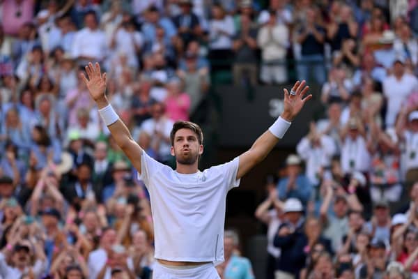 Cameron Norrie breathes hard after the titantic tussle with David Goffin, a victory which takes him into the Wimbledon semi-finals.