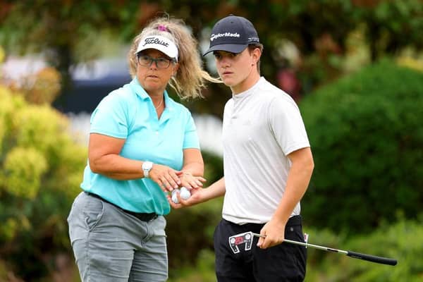 Frank Kennedy with caddie Fanny Sunesson on the putting green at The Belfry, where the young Englishman is making his prodessional debut in the Betfred British Masters hosted by Sir Nick Faldo. Picture: Andrew Redington/Getty Images.