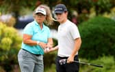 Frank Kennedy with caddie Fanny Sunesson on the putting green at The Belfry, where the young Englishman is making his prodessional debut in the Betfred British Masters hosted by Sir Nick Faldo. Picture: Andrew Redington/Getty Images.