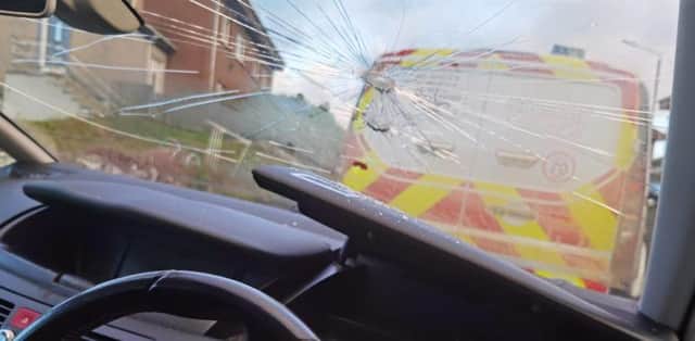 The windscreen of the players' car was smashed in a hammer attack.