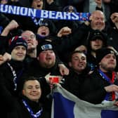 Rangers FC fans hold up scarves to show their support during the UEFA Europa League Round of 16 Leg Two match between Crvena Zvezda and Rangers FC at Rajko Mitic Stadium on March 17, 2022 in Belgrade, Serbia. (Photo by Srdjan Stevanovic/Getty Images)