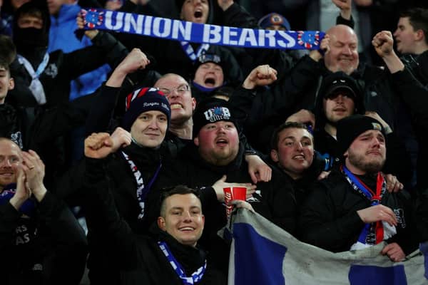 Rangers FC fans hold up scarves to show their support during the UEFA Europa League Round of 16 Leg Two match between Crvena Zvezda and Rangers FC at Rajko Mitic Stadium on March 17, 2022 in Belgrade, Serbia. (Photo by Srdjan Stevanovic/Getty Images)