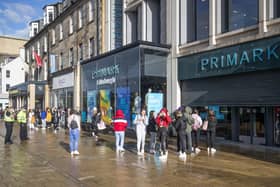 People queue outside the flagship Scottish Primark store on Princes Street in Edinburgh after it reopened following the initial spring 2020 lockdown. Picture: Jane Barlow/PA Wire