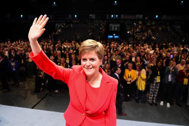 Nicola Sturgeon waves as she leaves the stage after her speech to delegates at the annual SNP conference in Aberdeen (Picture: AFP via Getty Images)
