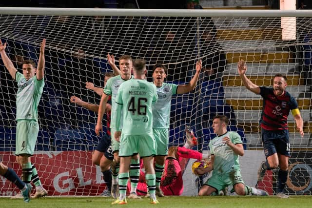 Ross County levelled through Yan Dhanda's corner, despite Hibs' best protestations.