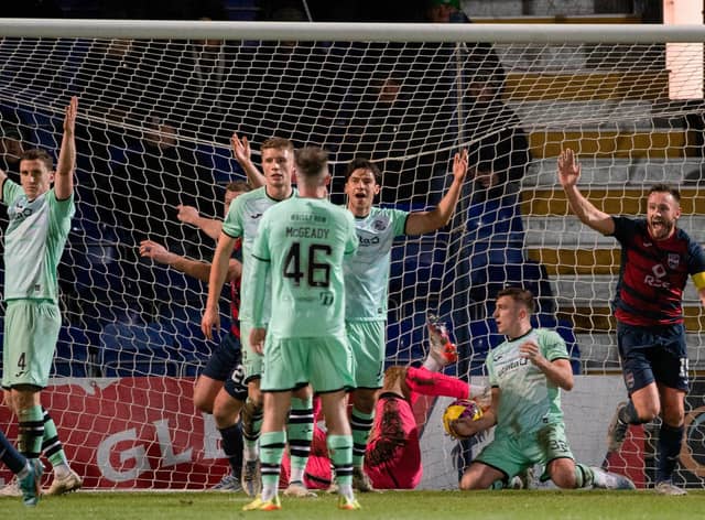 Ross County levelled through Yan Dhanda's corner, despite Hibs' best protestations.