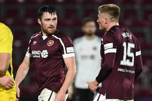 Hearts John Souttar and Taylor Moore exchange words during the match against Ross County.