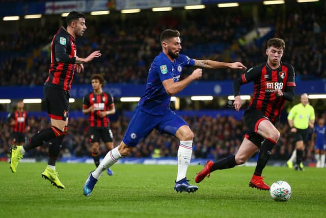 Olivier Giroud of Chelsea is challenged by Diego Rico and Jack Simpson of Bournemouth.  (Photo by Jordan Mansfield/Getty Images)