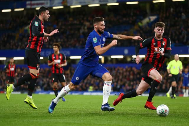 Olivier Giroud of Chelsea is challenged by Diego Rico and Jack Simpson of Bournemouth. (Photo by Jordan Mansfield/Getty Images)