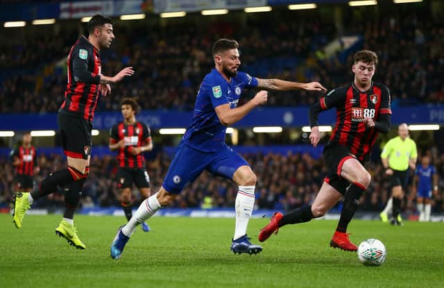 Olivier Giroud of Chelsea is challenged by Diego Rico and Jack Simpson of Bournemouth.  (Photo by Jordan Mansfield/Getty Images)