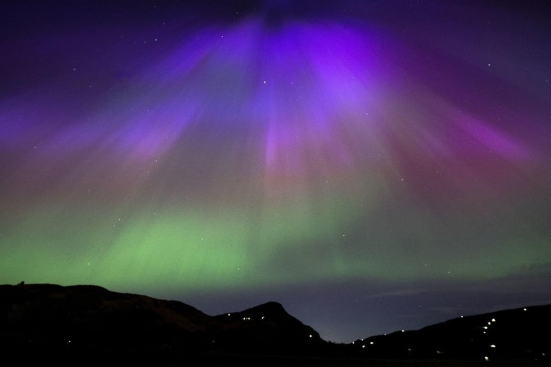 The aurora borealis, also known as the northern lights, above Arthur’s Seat and Salisbury Crags in Holyrood Park