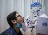 Artificially intelligent bots and robots may be capable of doing more jobs than we might expect (Picture: Khaled Desouki/AFP via Getty Images)