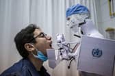 Artificially intelligent bots and robots may be capable of doing more jobs than we might expect (Picture: Khaled Desouki/AFP via Getty Images)