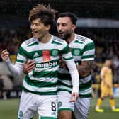 Celtic's Kyogo Furuhashi (left) celebrates his opening goal in the 3-0 win at Livingston.  (Photo by Alan Harvey / SNS Group)