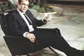 Sean Connery was disturbed by Bondmania from the moment a groupie dived through the window of his Aston Martin as he was driving to a premiere in Paris (Picture: AP)