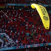 A Greenpeace protester flew into the stadium ahead of France vs Germany at Euro 2020. Photo: Getty Images