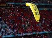 A Greenpeace protester flew into the stadium ahead of France vs Germany at Euro 2020. Photo: Getty Images