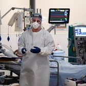 A member of staff at University Hospital Monklands attends to a Covid-positive patient on the ICU ward in 2021 in Airdrie. Picture: Jeff J Mitchell/Getty Images