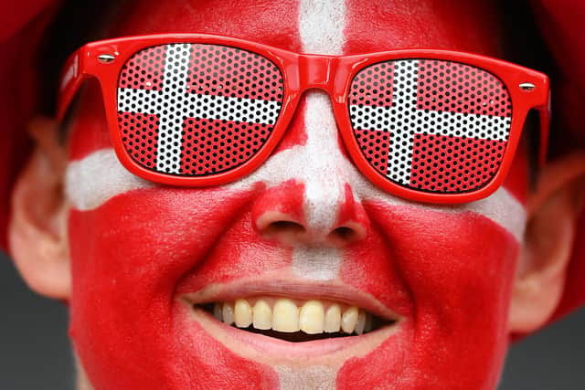 MILTON KEYNES, ENGLAND - JULY 12: A Denmark fan wearing face paint of their countries flag looks on prior to the UEFA Women's Euro 2022 group B match between Denmark and Finland at Stadium mk on July 12, 2022 in Milton Keynes, England. (Photo by Justin Setterfield/Getty Images)