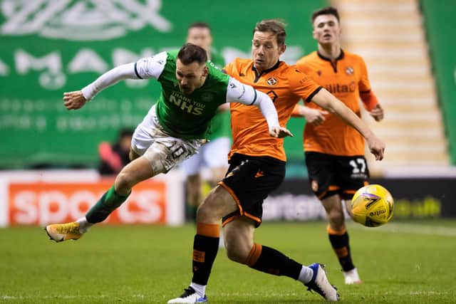Dundee United's Peter Pawlett halts Martin Boyle's progress during the Premiership match between Hibs and Dundee United at Easter Road. Photo by Ross Parker / SNS Group