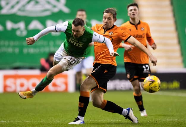 Dundee United's Peter Pawlett halts Martin Boyle's progress during the Premiership match between Hibs and Dundee United at Easter Road. Photo by Ross Parker / SNS Group