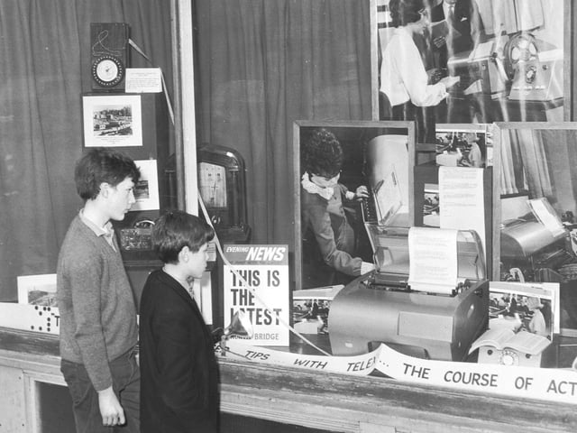 Two youngsters look at the new GPO telex machine displayed at 118 George Street, Edinburgh, in March 1966.