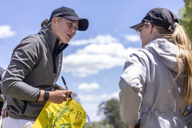 Hannah Darling signs an autograph for a young spectator after finishing round two of the Augusta National Women's Amateur at Champions Retreat Golf Club in Georgia. Picture: Chloe Knott/Augusta National