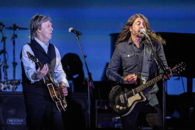 Paul McCartney, left, and Dave Grohl perform at the Glastonbury Festival in Worthy Farm, Somerset, England, Saturday, June 25, 2022.