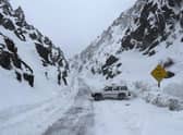 Emergency services rescued a driver left stranded on the road leading into California's Death Valley National Park as the west coast of the US is hit with unprecedented levels of snowfall. Picture: AP