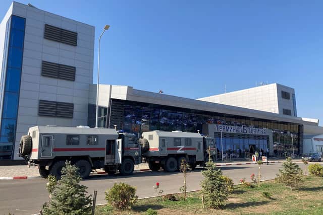 This photograph shows Russian National Guard vans parked at the airport in Makhachkala on Monday.