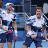 Neal Skupski and Jamie Murray celebrate defeating Andres Molteni and Horacio Zeballos of Argentina