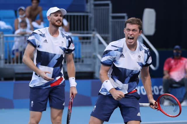 Neal Skupski and Jamie Murray celebrate defeating Andres Molteni and Horacio Zeballos of Argentina
