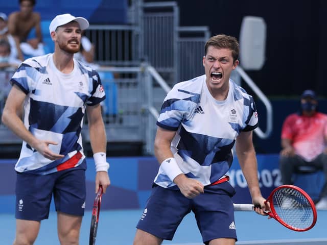 Neal Skupski and Jamie Murray celebrate defeating Andres Molteni and Horacio Zeballos of Argentina