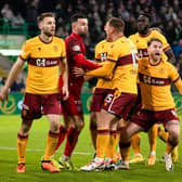 Motherwell players surround Liam Kelly after his penalty save from Celtic's Luis Palma. (Photo by Craig Williamson / SNS Group)