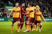 Motherwell players surround Liam Kelly after his penalty save from Celtic's Luis Palma. (Photo by Craig Williamson / SNS Group)