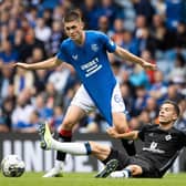 Rangers youngster Bailey Rice is pulled down by Hamburg's László Bénes during a pre-season friendly at Ibrox in July.  (Photo by Alan Harvey / SNS Group)